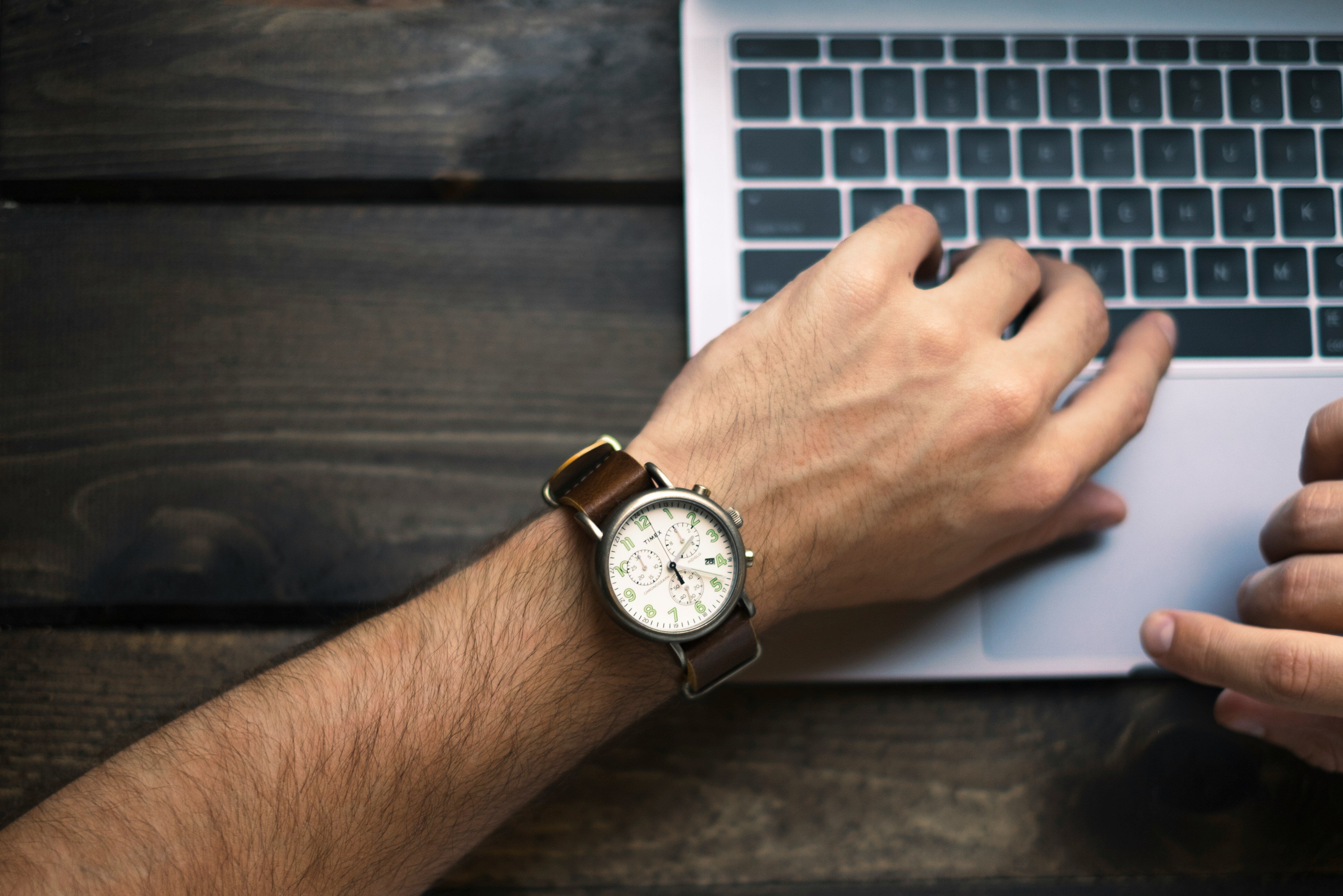 man looking at watch