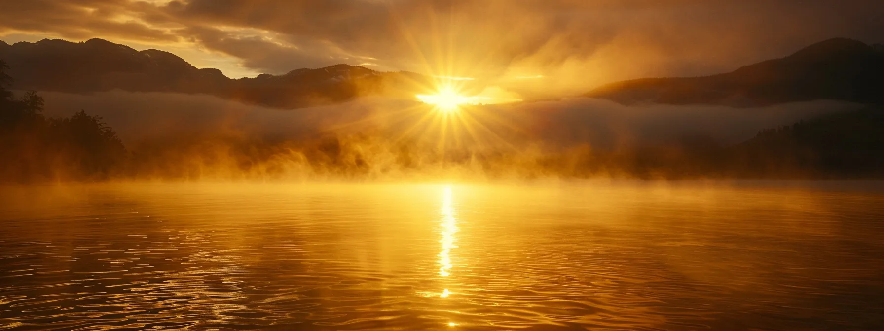a breathtaking sunrise casts golden rays over a serene lake, where mist gently rises, enveloping silhouettes of distant mountains in an ethereal glow.