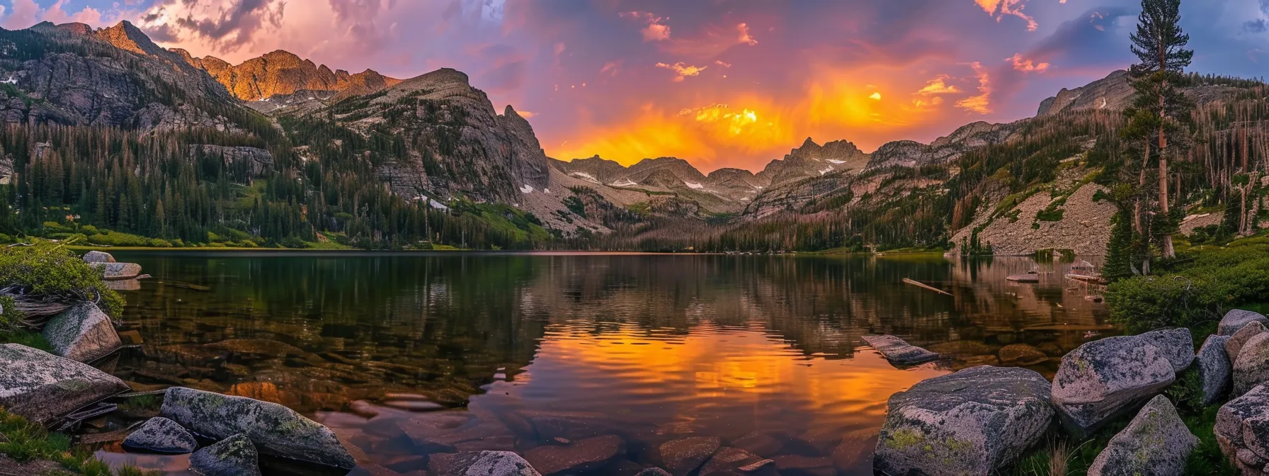 a breathtaking sunset casts a golden glow over a tranquil lake surrounded by majestic mountains, reflecting vivid hues of orange and purple in the still water.