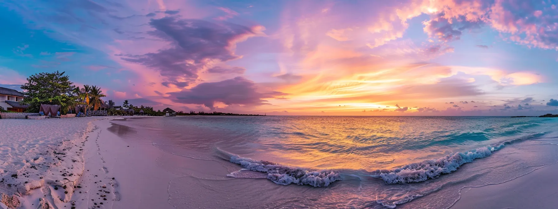 a vibrant sunset casts a warm glow over a serene beach, where gentle waves caress the shore and colorful clouds reflect hues of orange, pink, and purple across the tranquil sky.