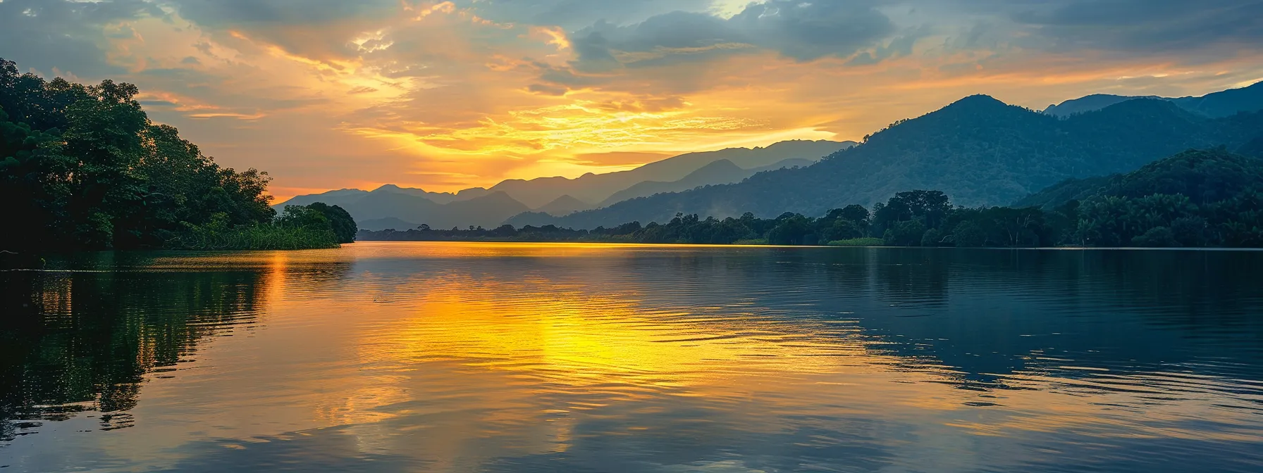 a vibrant sunset casts a warm golden glow over a serene lake, reflecting the surrounding lush mountains and creating a tranquil, picturesque scene.