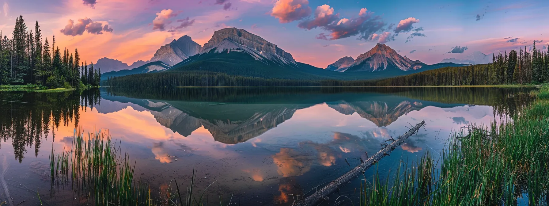 a vibrant sunset casts a golden hue over a serene lake, reflecting the silhouettes of towering mountains and lush forests on its glassy surface.
