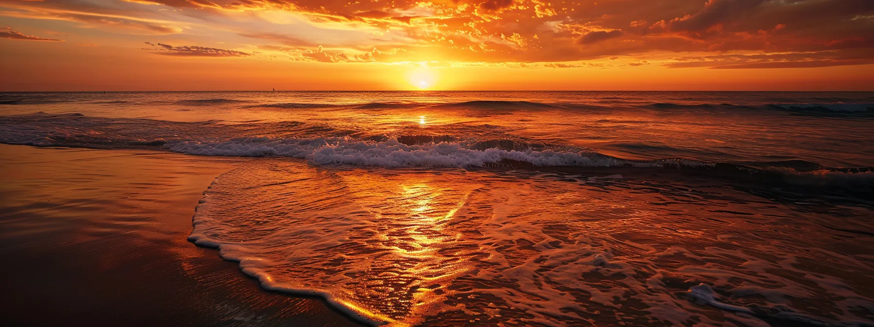 a vibrant sunset casts a golden glow over a tranquil ocean, where gentle waves reflect the fiery hues of the sky, creating a serene and captivating seascape.
