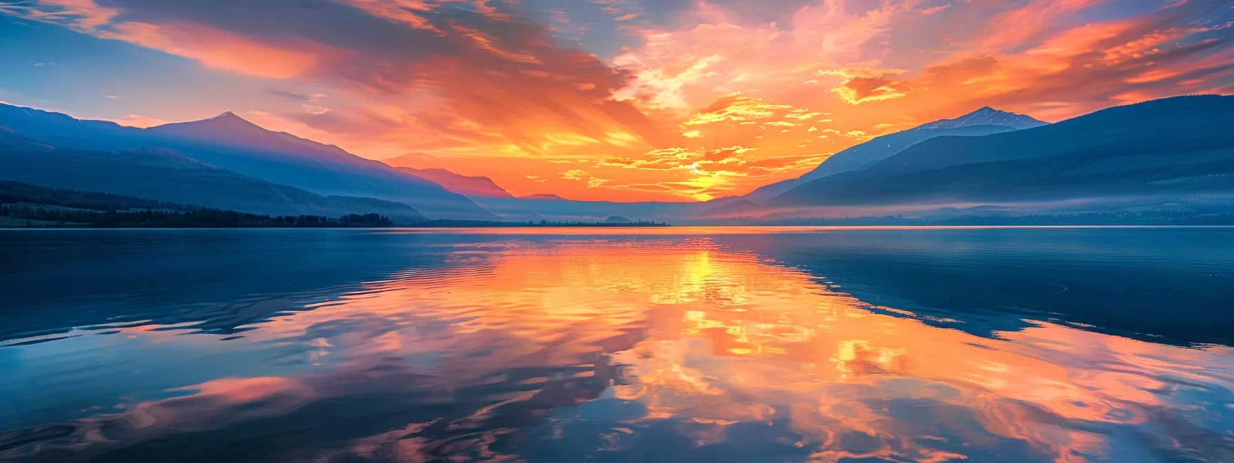 a vibrant sunset casts golden hues over a serene lake, where majestic mountains reflect perfectly on the water's surface, creating an enchanting atmosphere of tranquility and natural beauty.