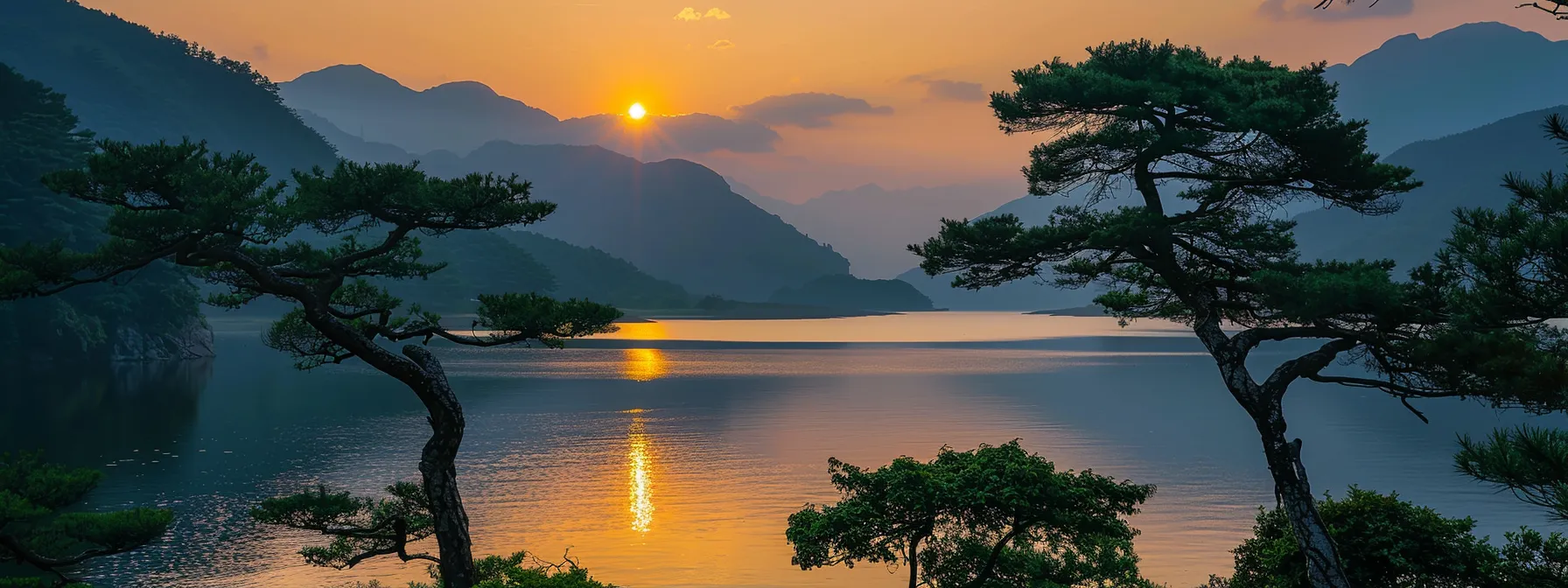 a vibrant sunset casts golden rays over a tranquil lake, its surface reflecting the fiery colors of the sky while silhouettes of towering pine trees frame the serene landscape.